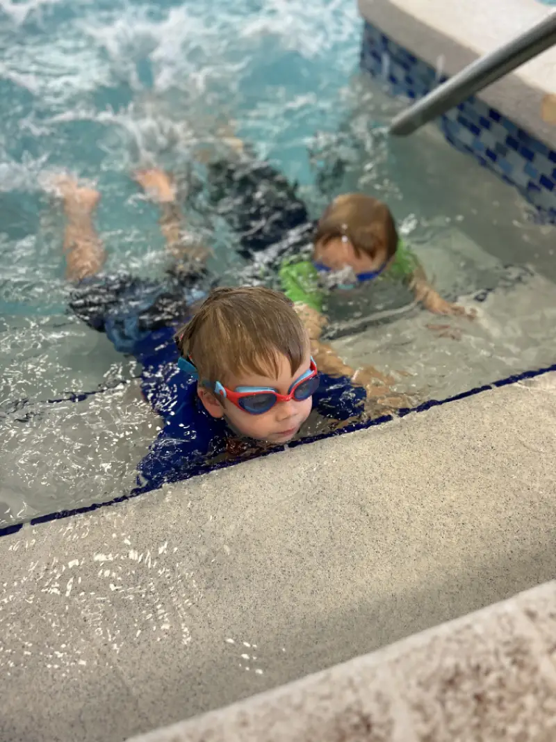 Group classes star 2 happy childrens group at swimming pool class learning to swim