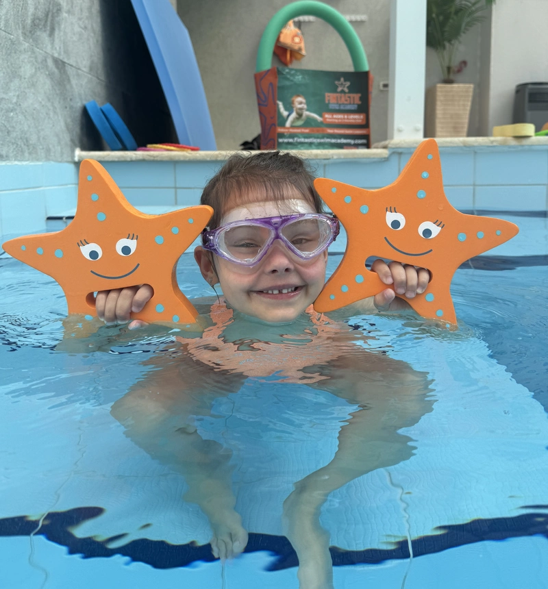 Birthday Party Page 2 Young partygoer at a pool birthday party with Fintastic